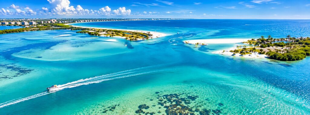 Aerial coastal view of Dunedin Florida with turquoise Gulf waters and islands